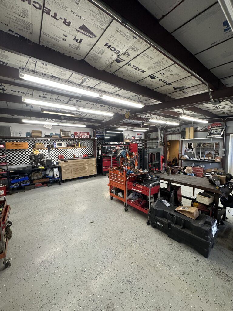 Picture of inside of auto mechanic shop with tool boxes 